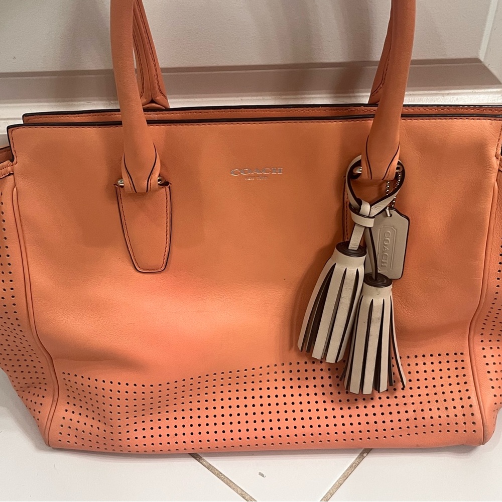 Coach leather Candace perforated tote in peach/tan lining. S/N (A1320-22490).